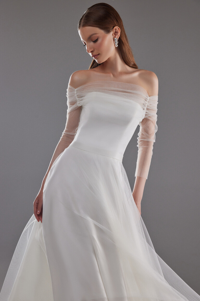 Front view of Millie minimalist wedding dress bodice with sheer sleeves and defined waist