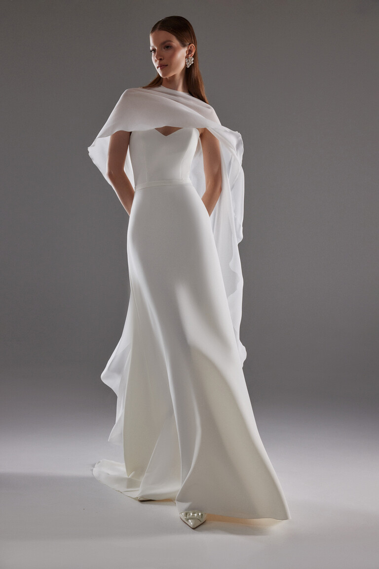 Cape Emm minimalist chiffon bridal cape draped over shoulders of strapless wedding dress