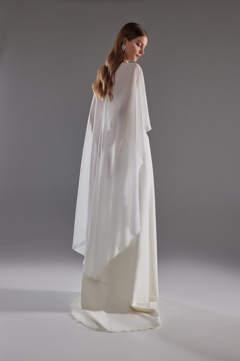 Back view of Cape Emm off-white chiffon bridal cape draping to floor length