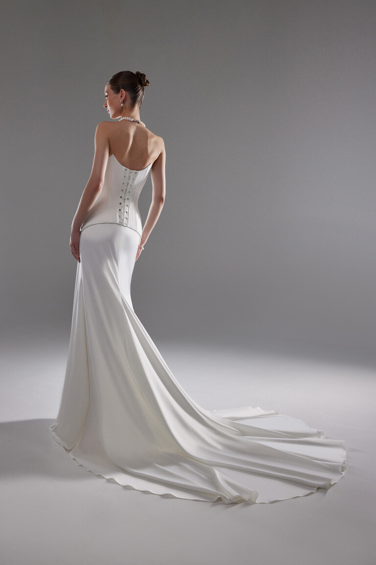 Back view of Eliana wedding dress showing lace-up corset and long satin train