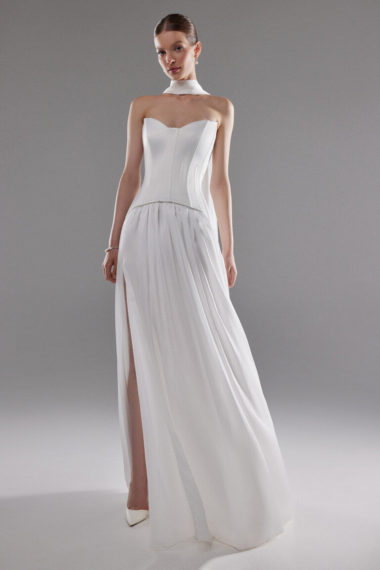 Full length Artemide bridal gown in off-white showing A-line silhouette and leg slit