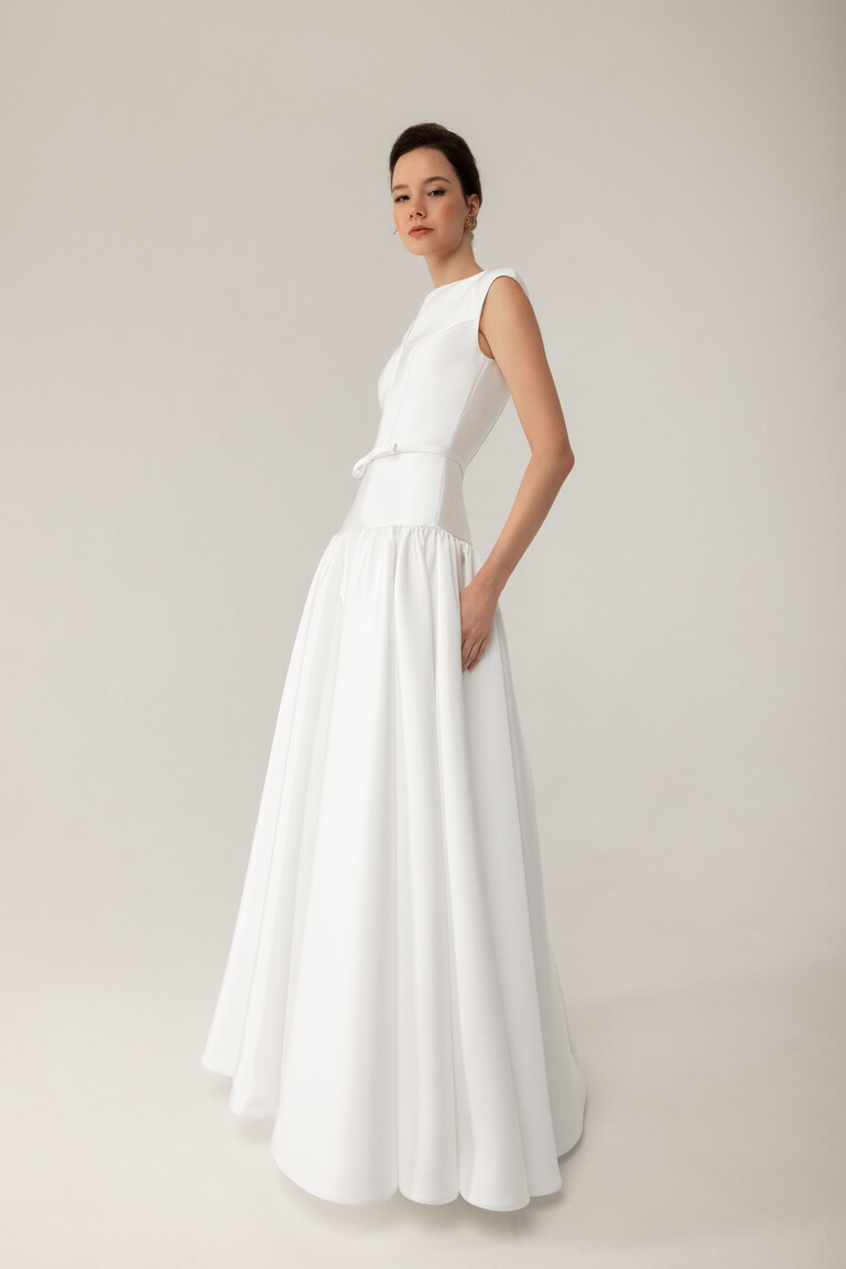 Elegant Mikado Dress with Functional Pockets Lika mikado bridal gown side view showing functional pockets and voluminous pleated skirt