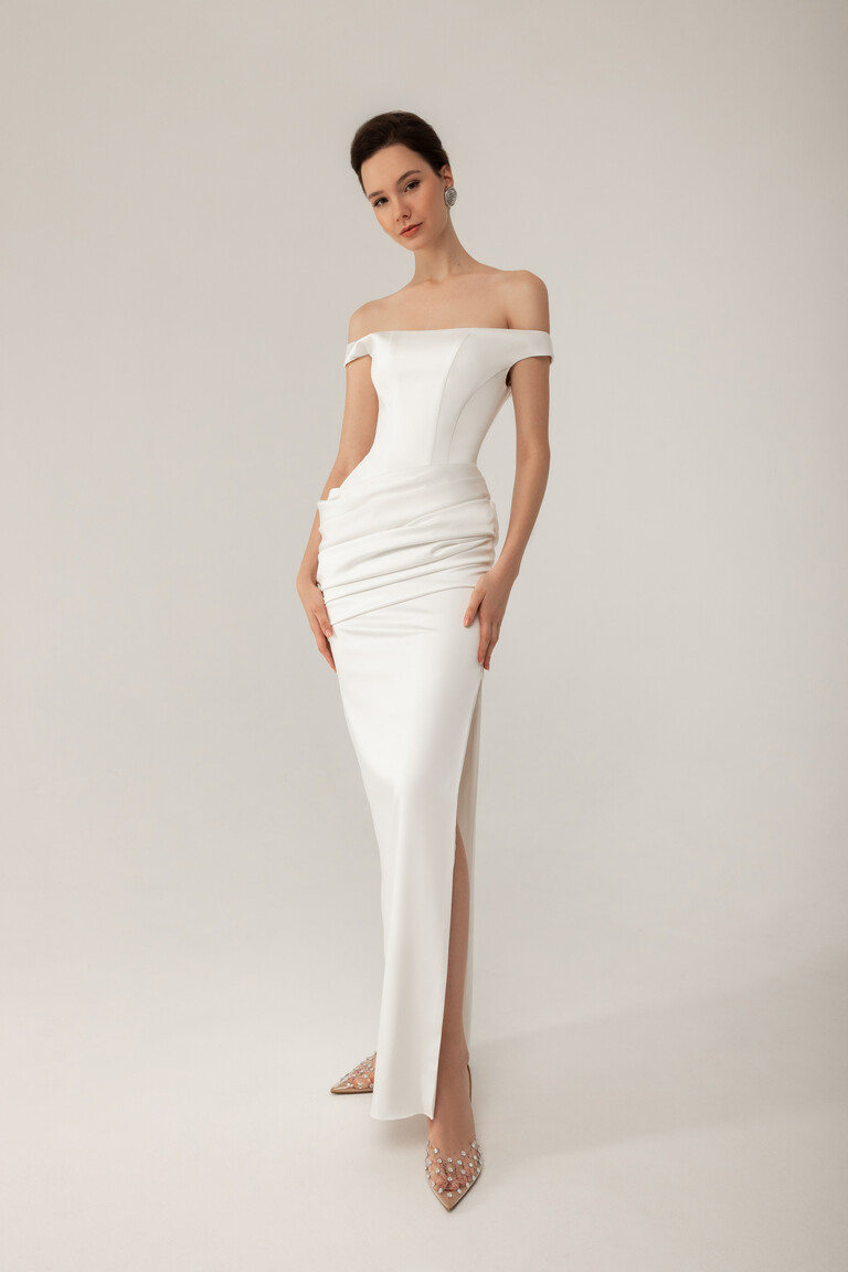 Front view of Kaira ivory wedding gown featuring high thigh slit and off-the-shoulder neckline
