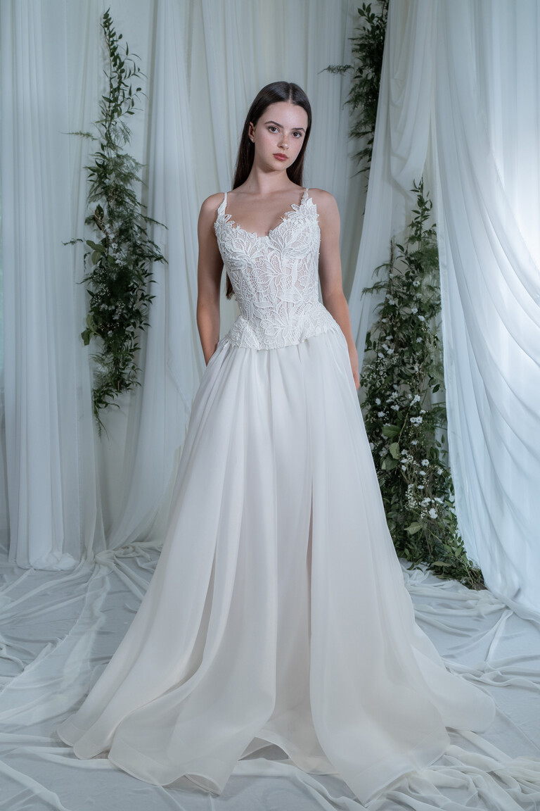 Romantic Off-White Wedding Dress with Defined Waistline Full length Freya bridal gown showing structural lace bodice and flowing organza skirt layers