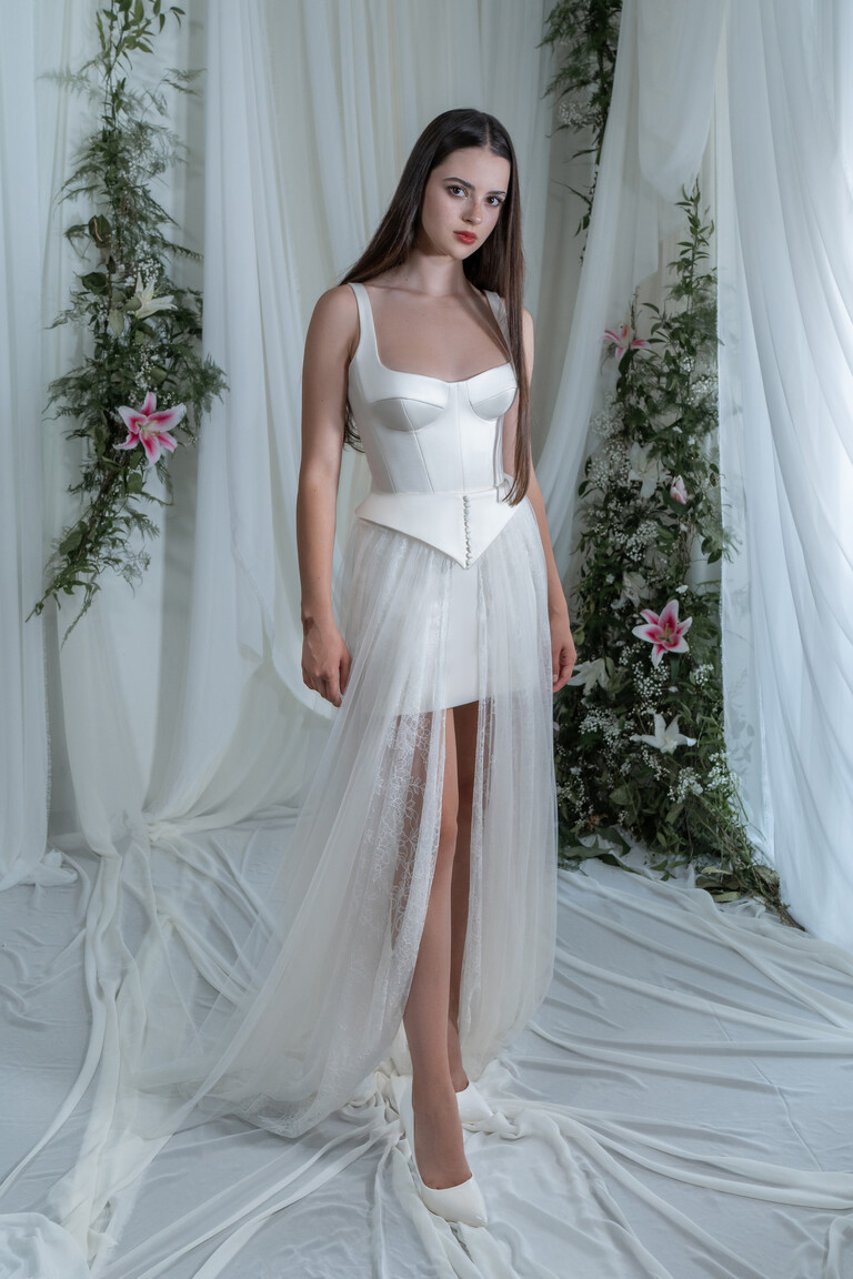 Emily square neckline wedding dress with wide straps and lace trim on sheer floor length skirt