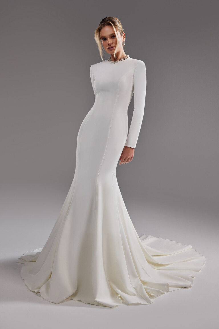 Odetta off-white crepe wedding dress front view featuring princess seams and flared skirt