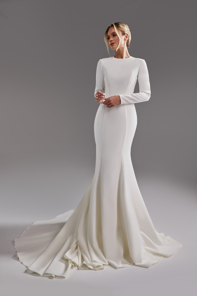 Odetta stretch crepe mermaid wedding dress showing smooth fabric and voluminous train