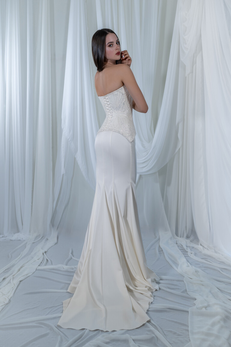 Milana mermaid wedding dress side back view highlighting basque waist and satin train