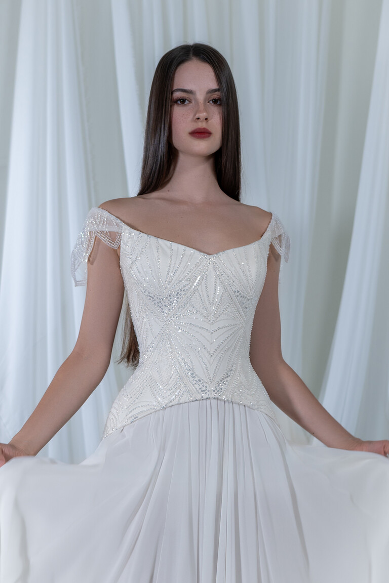 Divine dress beaded corset detail with sequins and off-white pleated chiffon skirt texture