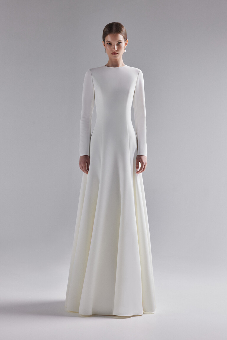 Front view of Stella long sleeve flared wedding dress showing fitted bodice