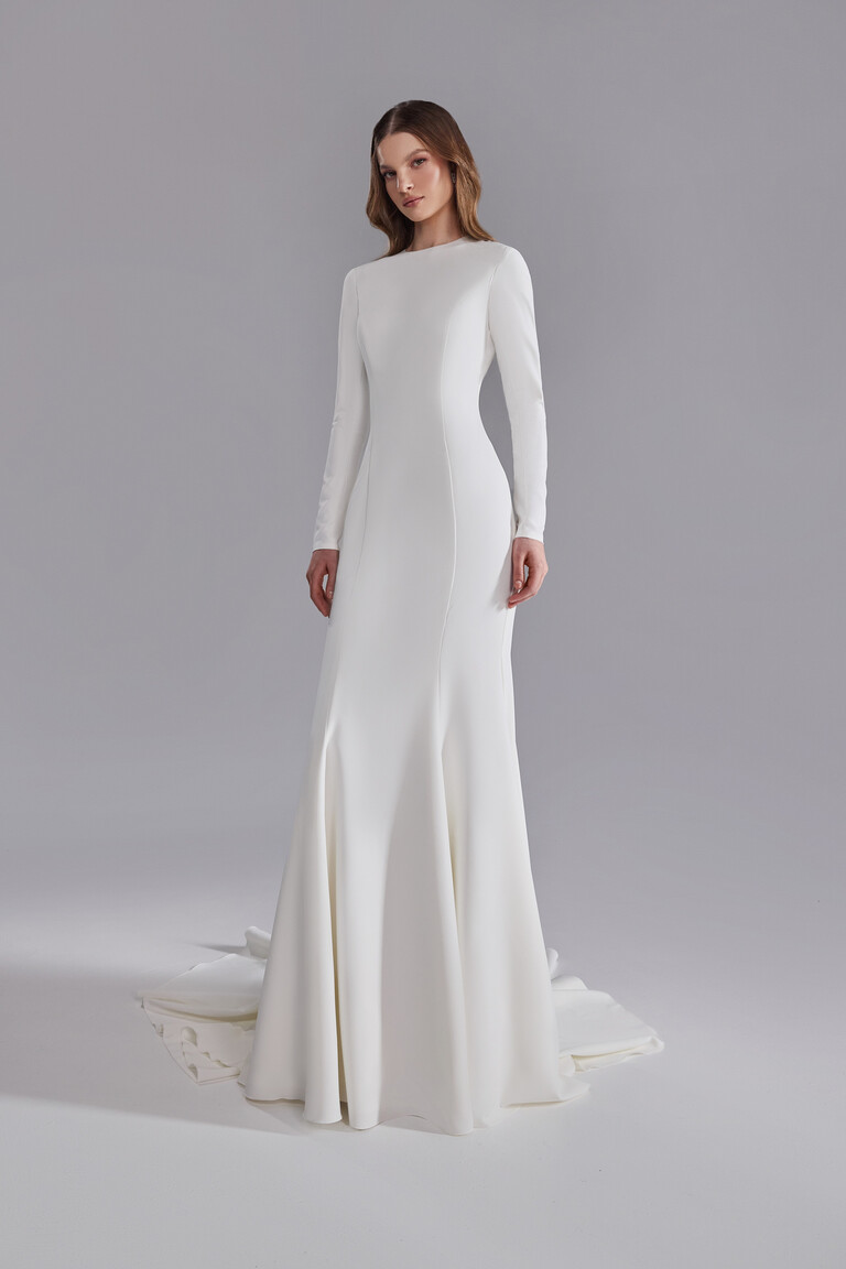 Odetta modern modest wedding dress featuring high jewel neckline and long sleeves