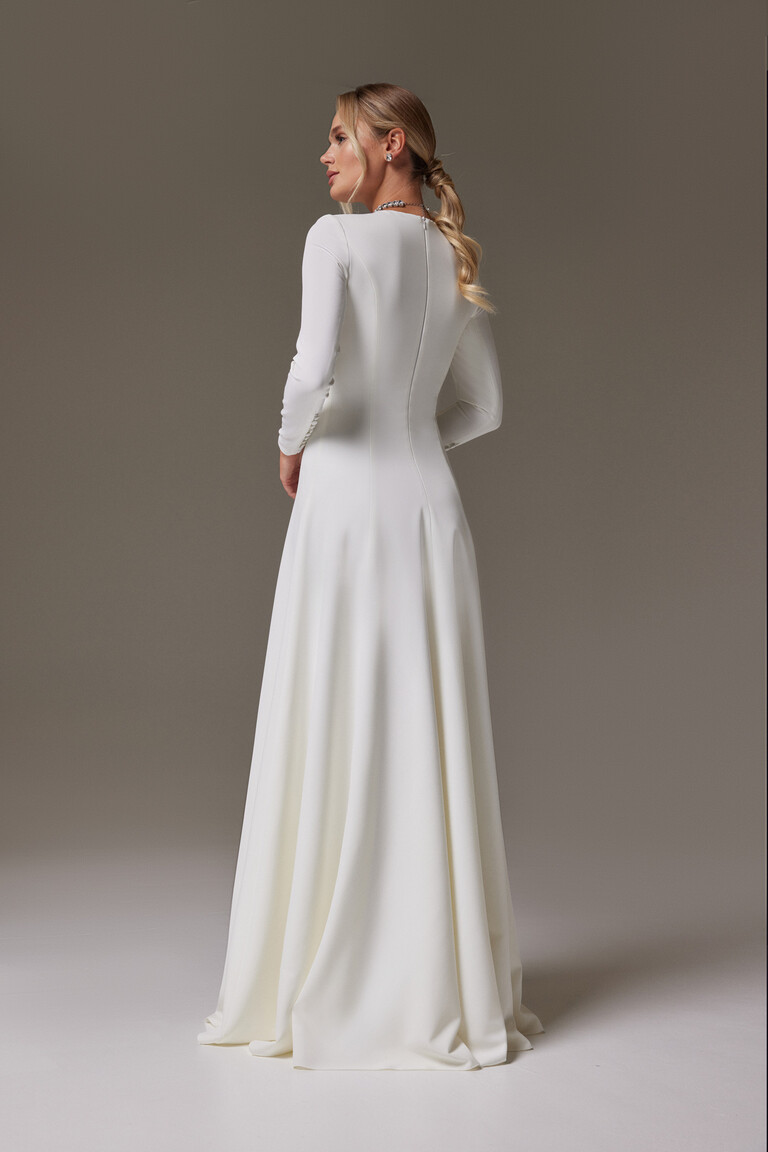 Back view of Stella long sleeve wedding dress with vertical elongating seams