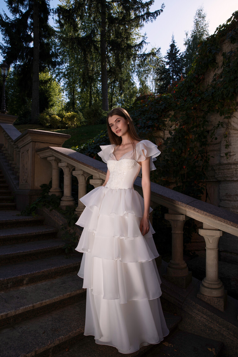 Cvit wedding dress front view featuring lace applique bodice and multi-tiered organza skirt