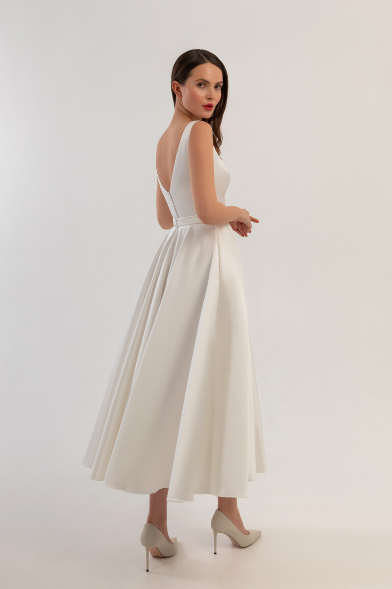 Back view of Vlada A-line midi wedding dress featuring V-back and satin buttons