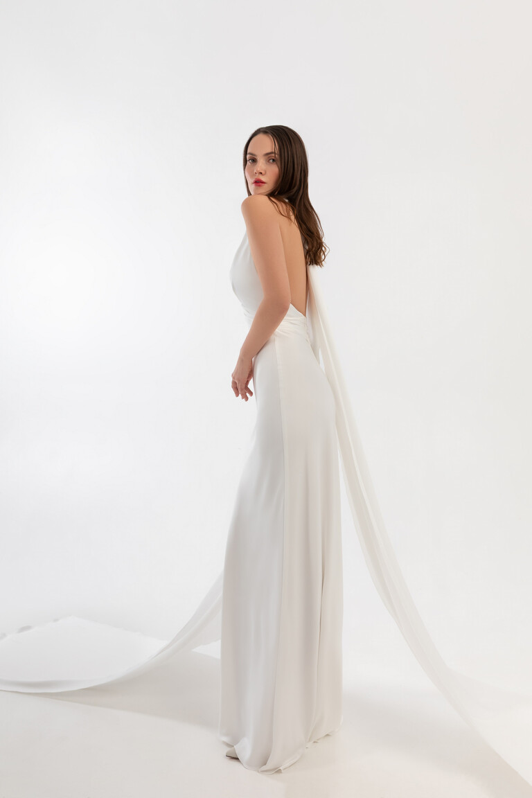 Side profile of Athena silk slip dress showing open back and long flowing fabric streamers