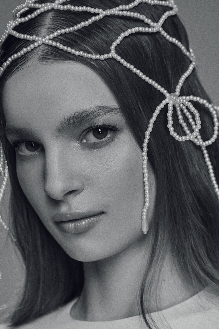 Black and white portrait focusing on pearl net headpiece worn with Odetta bridal gown
