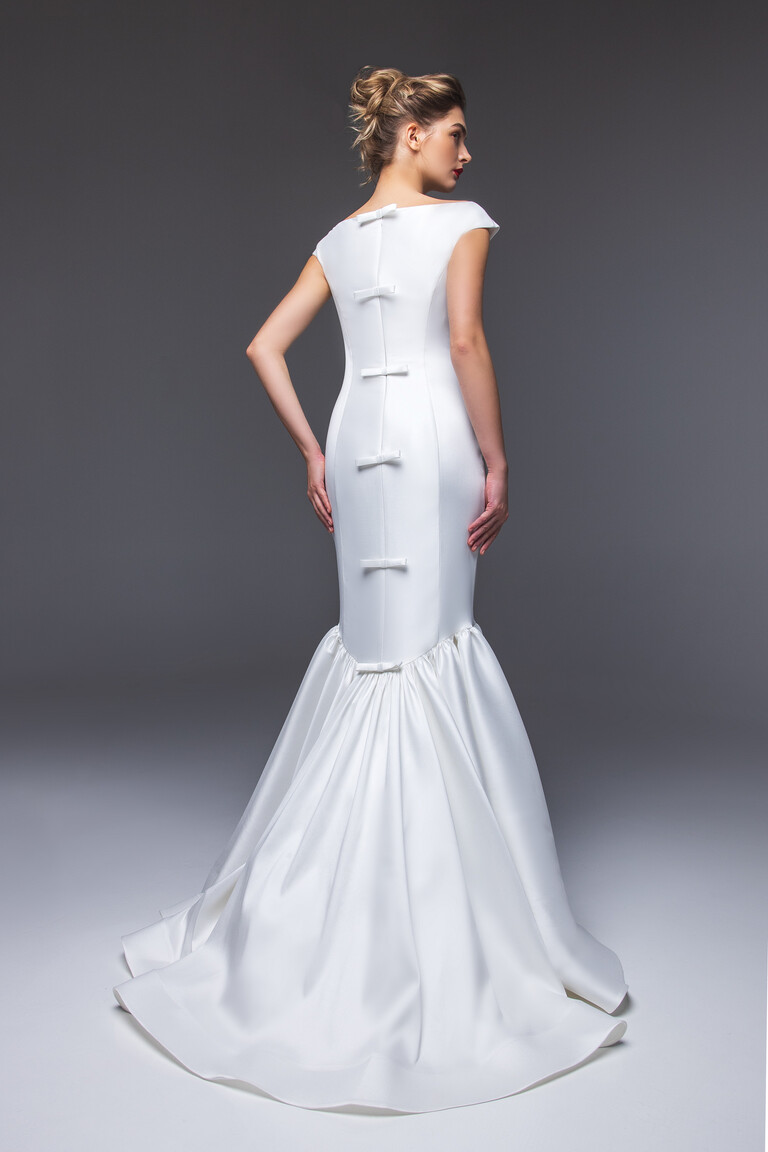 Rachel wedding dress back view showing decorative bows down center seam