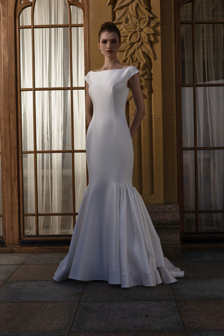 Full length Rachel mikado wedding dress front view with boat neck in luxury setting