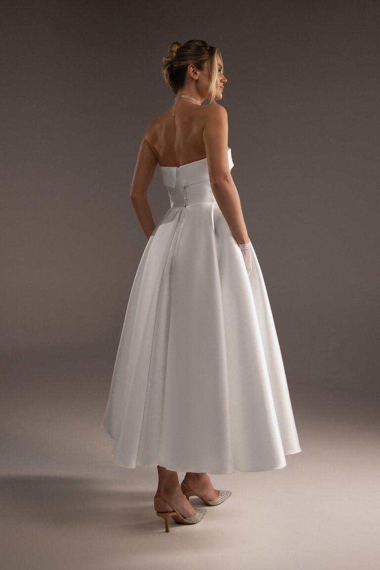 Classic Button Back Detail on Midi Wedding Dress Back view of Sophie Midi ivory dress featuring button details and tea-length A-line skirt silhouette