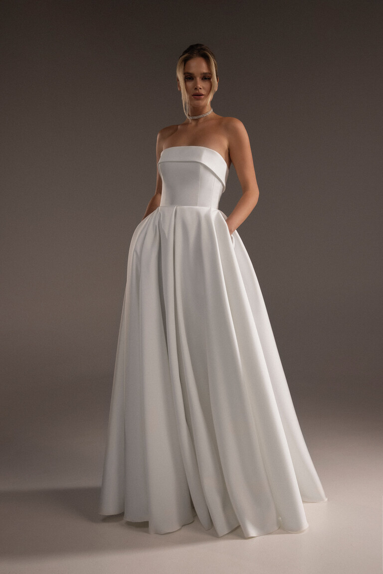 Sophie ivory Mikado wedding dress front view with strapless flap corset and side pockets