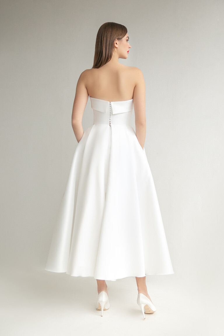 Modern Minimalist Tea-Length Bridal Look Sophie Midi strapless wedding dress back view showing mid-calf length and structured Mikado fabric
