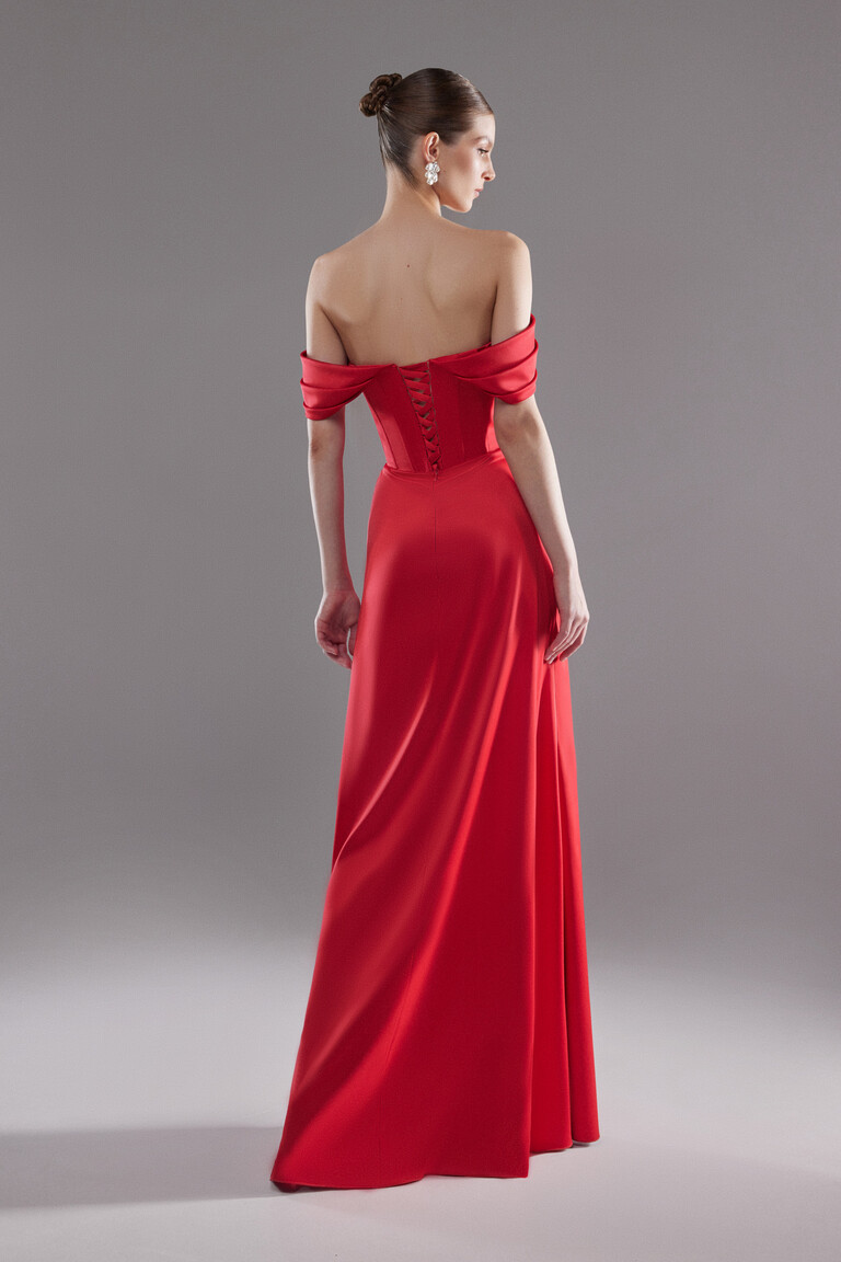 Back view of Riley red satin gown featuring lace-up corset closure and open back