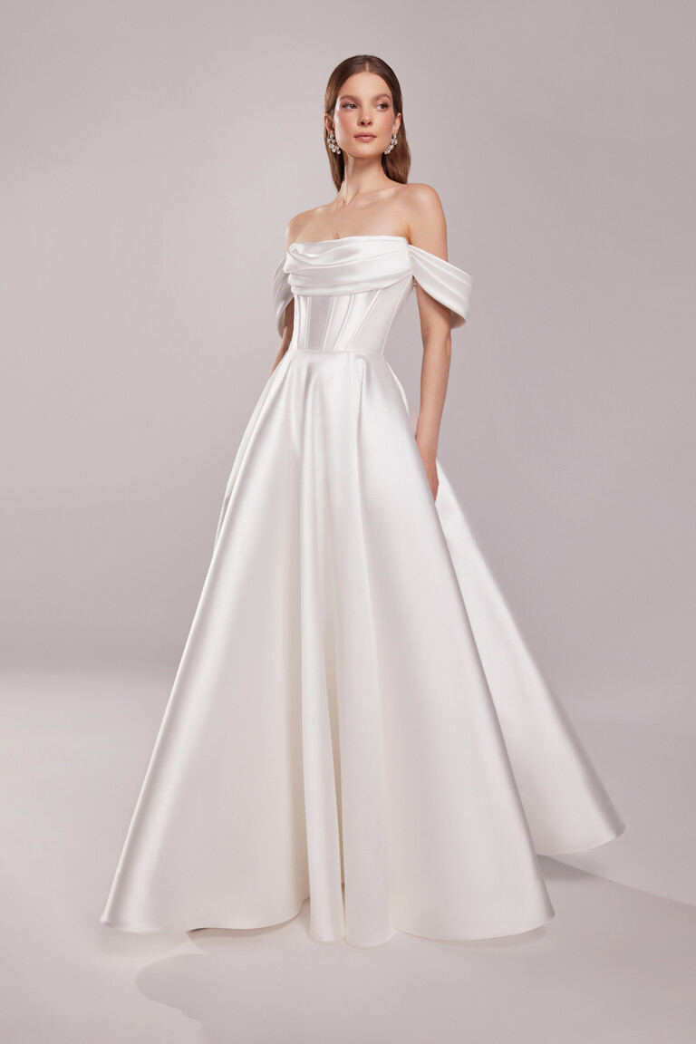 Modern minimalist Sunny wedding dress in ivory mikado with structured bodice and draped sleeves