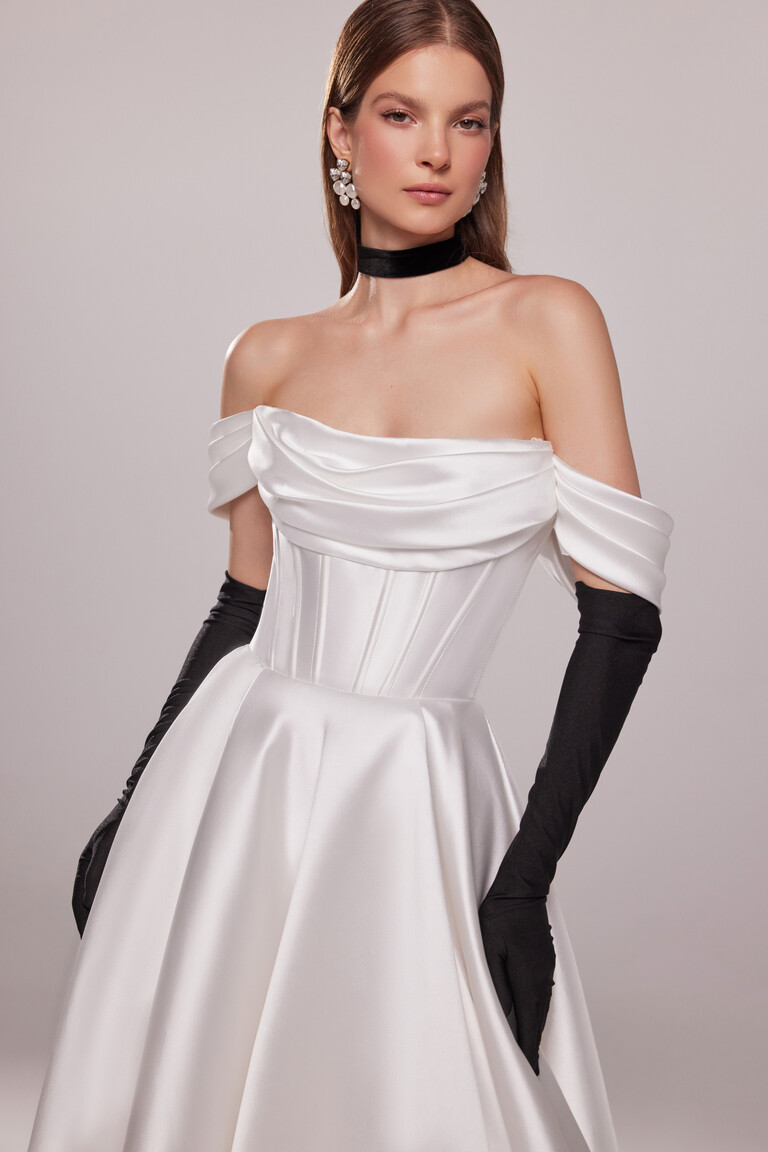 Glamorous styling of Sunny mikado wedding dress with black gloves and structured corset bodice