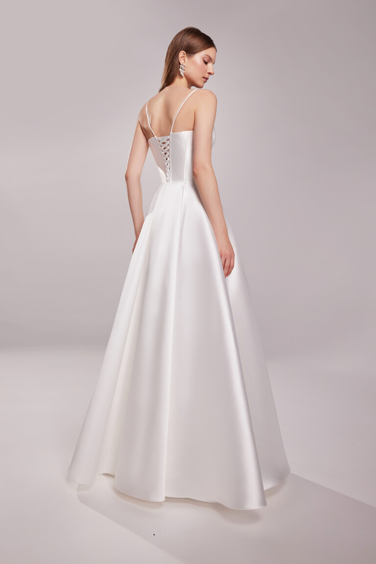 Back view of Sunny Sleeveless wedding dress featuring lace-up corset closure and A-line skirt