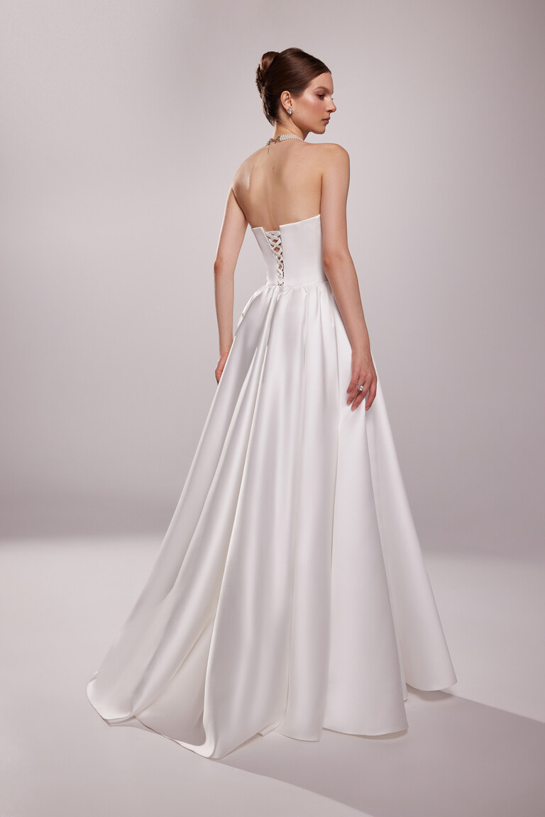 Lace Up Back Detail on Satin Ball Gown Back view of Tessa ivory satin bridal gown featuring lace up corset and full skirt