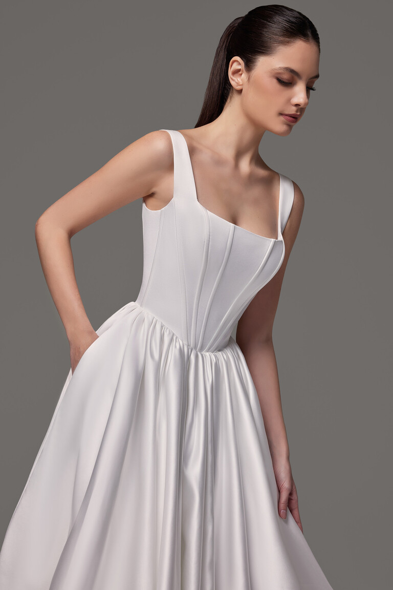 Casia satin bridal gown medium shot showing square neckline and pocket detail
