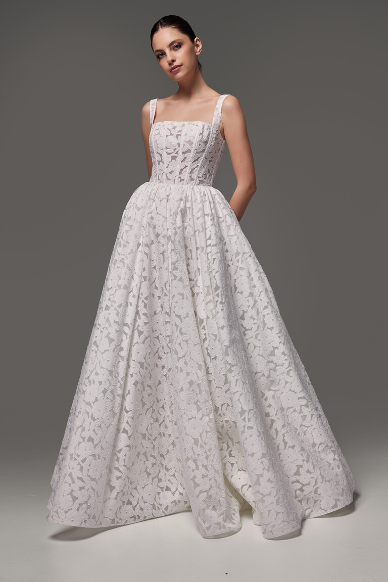 Front view of Ruta wedding dress highlighting semi-sheer floral lace texture