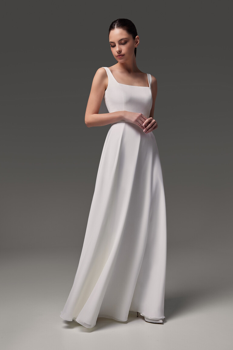 Unona Evita sleeveless wedding dress full length front view in soft studio lighting