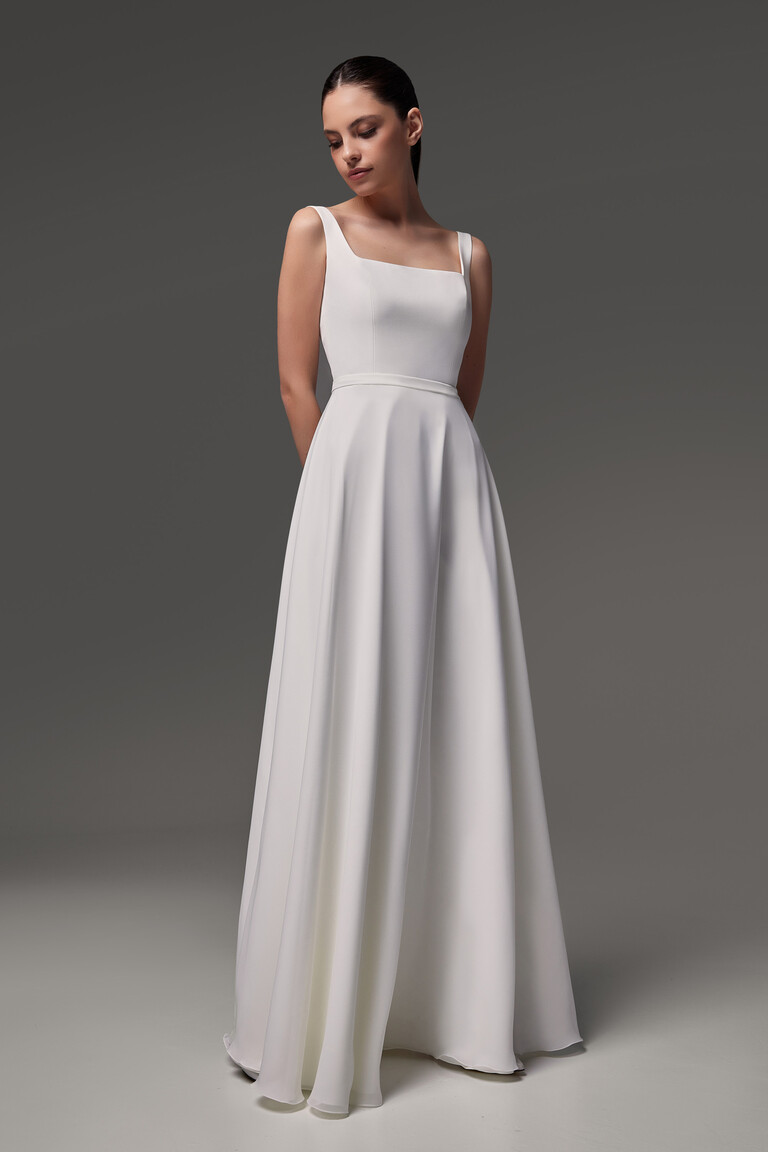 Modern minimalist wedding dress Evita front view showing natural waistline and A-line cut