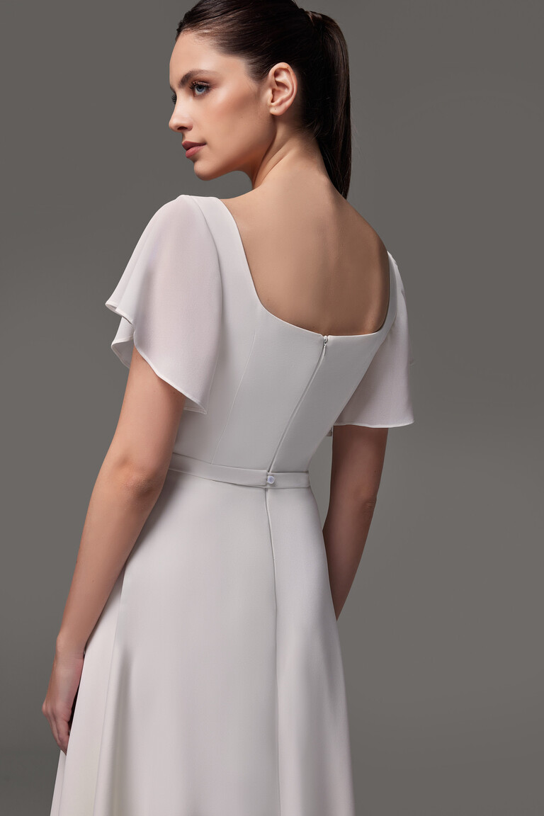 Close up back view of Edda dress showing zipper closure and waist belt accent