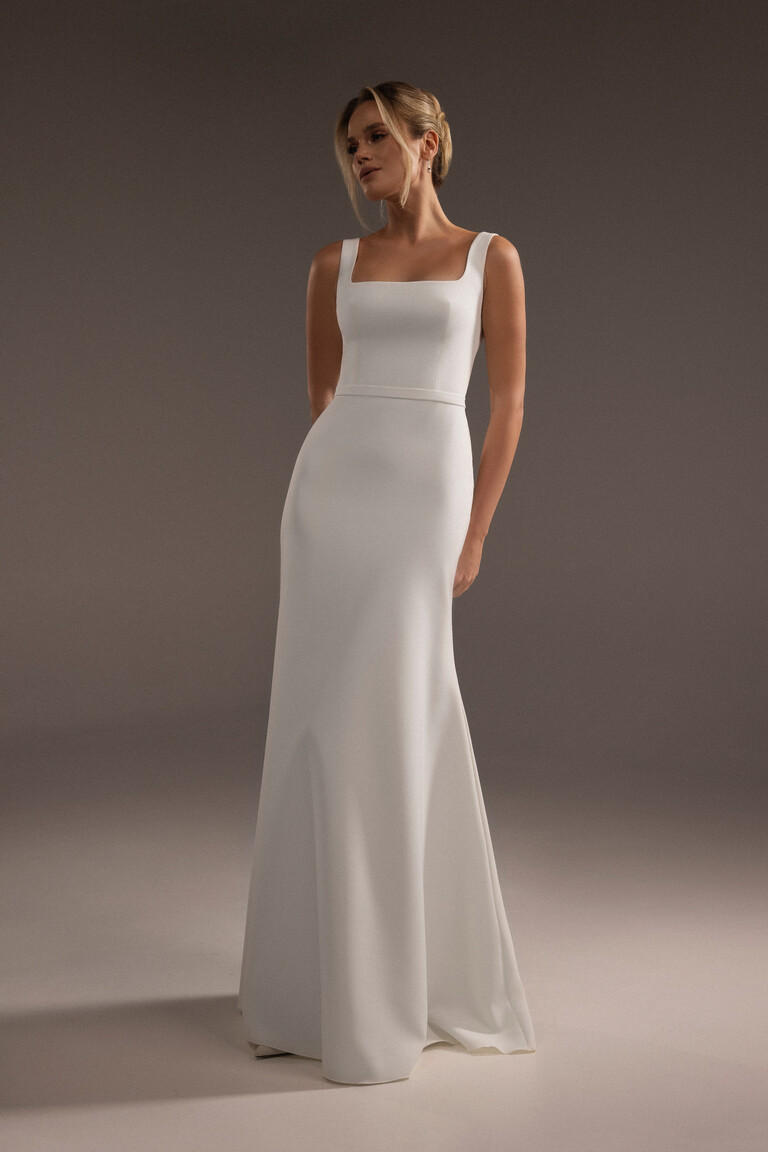 Bethany minimalist crepe bridal gown front view showing sheath silhouette and vertical seams