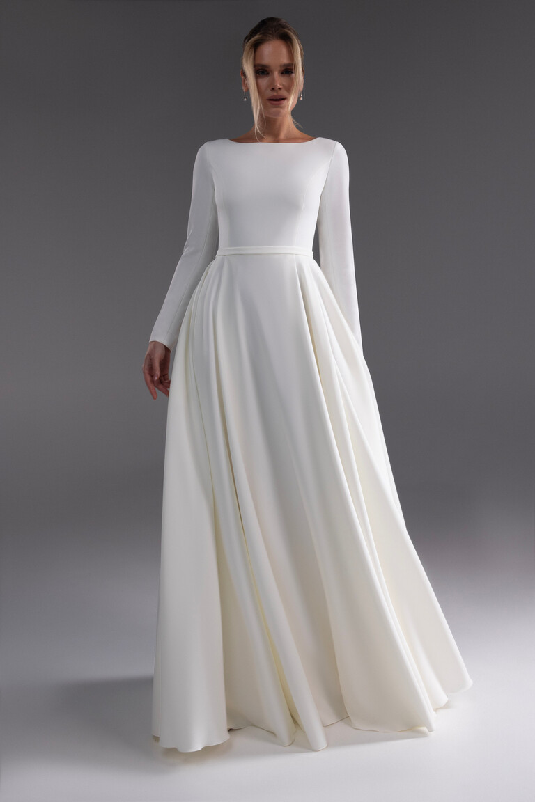 Adria gown featuring fitted bodice and voluminous A-line crepe skirt