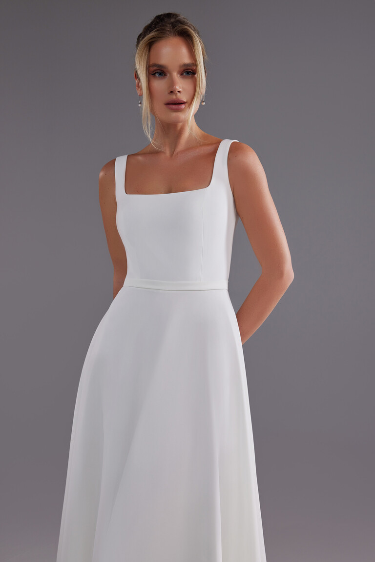 Evita bridal gown bodice detail showing square neck and delicate waist belt in ivory crepe