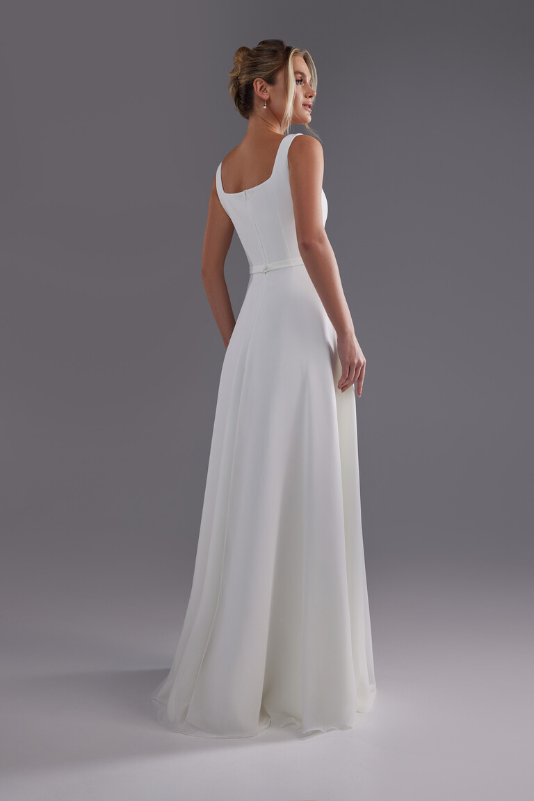 Evita wedding dress back view showing square back design and flowing chiffon skirt