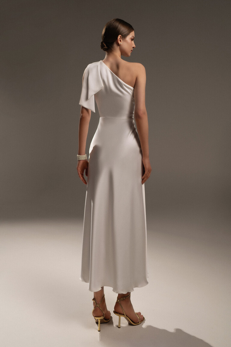 Rear view of Unona Julia ivory satin dress showing midi length and sleek column silhouette