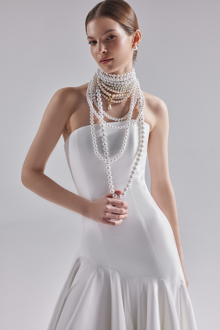 Close up of Holly gown bodice showing vertical contouring seams and pearl styling