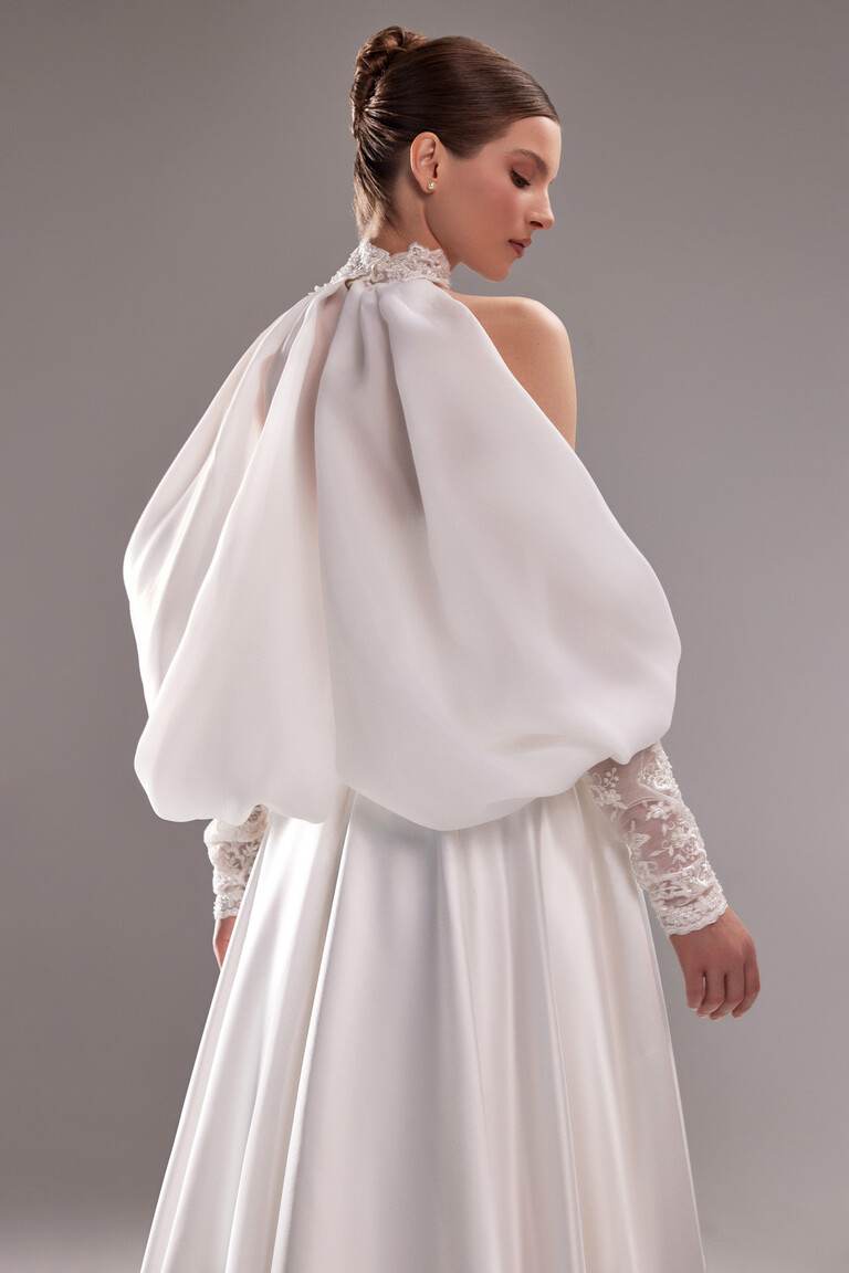 Sheer Lace Sleeves and Cape Effect Demna bridal gown rear view with sheer lace sleeves and voluminous satin cape effect
