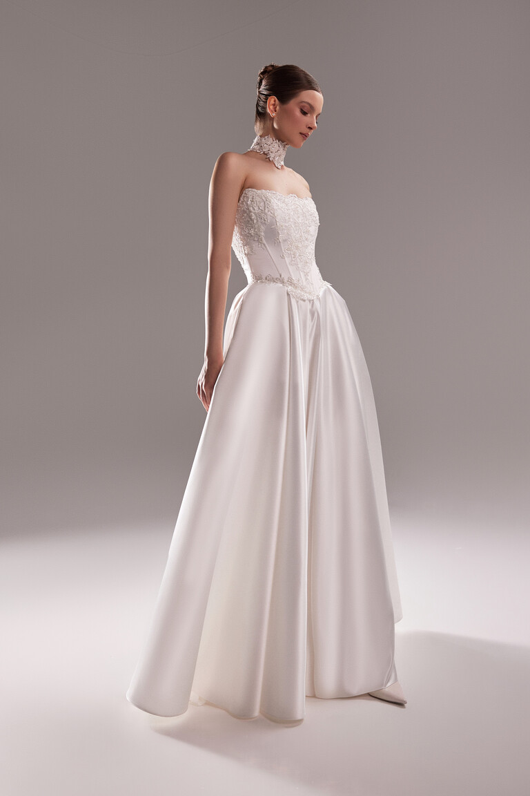 Three quarter view of Demna satin wedding dress showing voluminous skirt