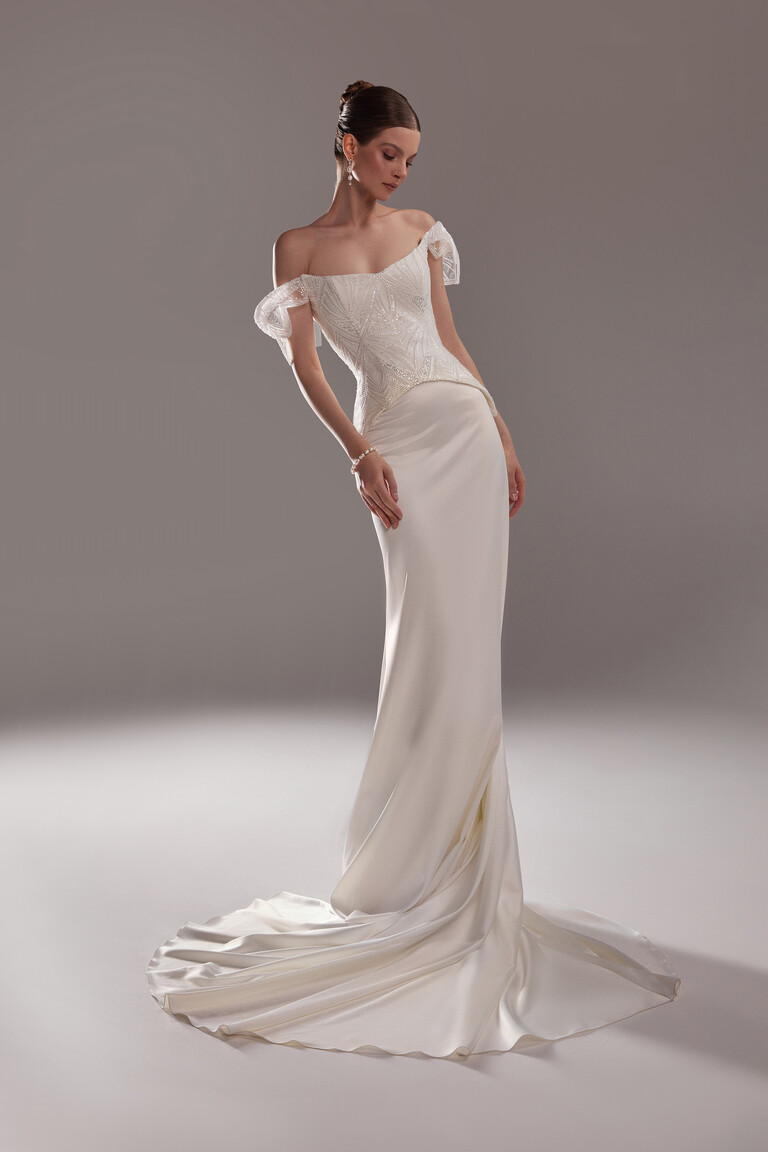 Elegant Off-the-Shoulder Lace & Satin Gown Full length Diva bridal gown showing off-the-shoulder lace bodice and fitted stretch satin skirt