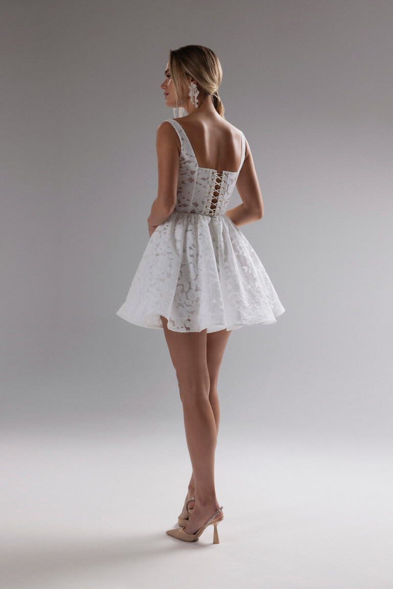 Full back view of Ruta off-white mini wedding dress with lace-up closure and A-line silhouette