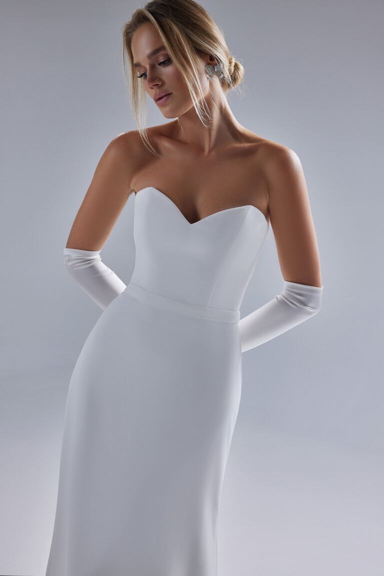 Adeline bridal gown front view with plunging sweetheart neckline and princess seams