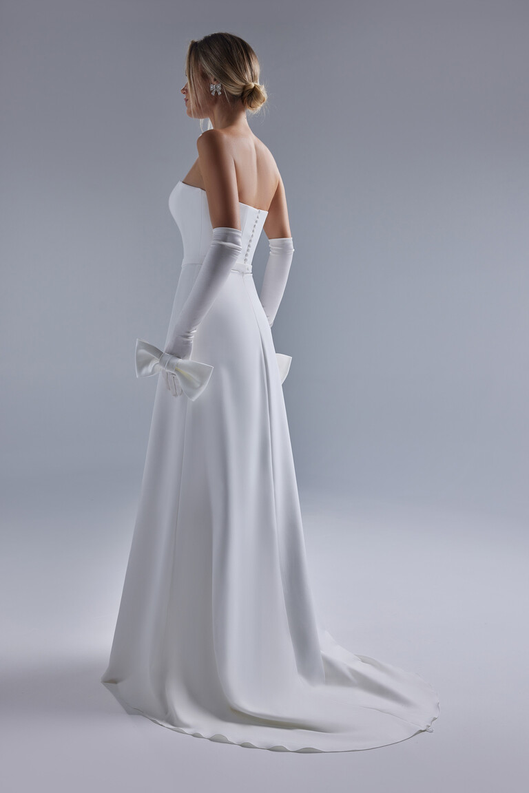Back view of Adeline wedding dress showing row of buttons and chapel train