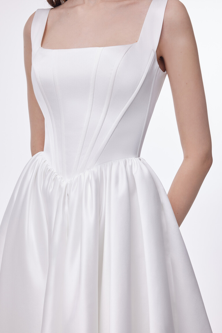 Detailed view of Casia dress bodice with square neckline and pointed basque waist structure