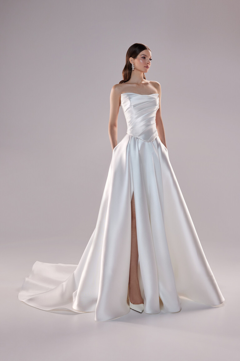 Unona Tori A-line wedding dress in ivory satin showing strapless neckline and modern silhouette