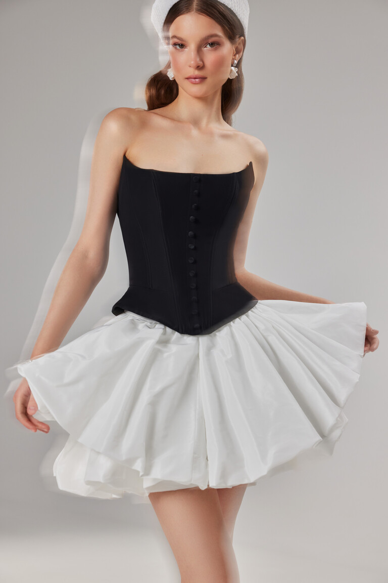 Amira Mini color block prom dress with a structured black strapless top and a short A-line ivory skirt